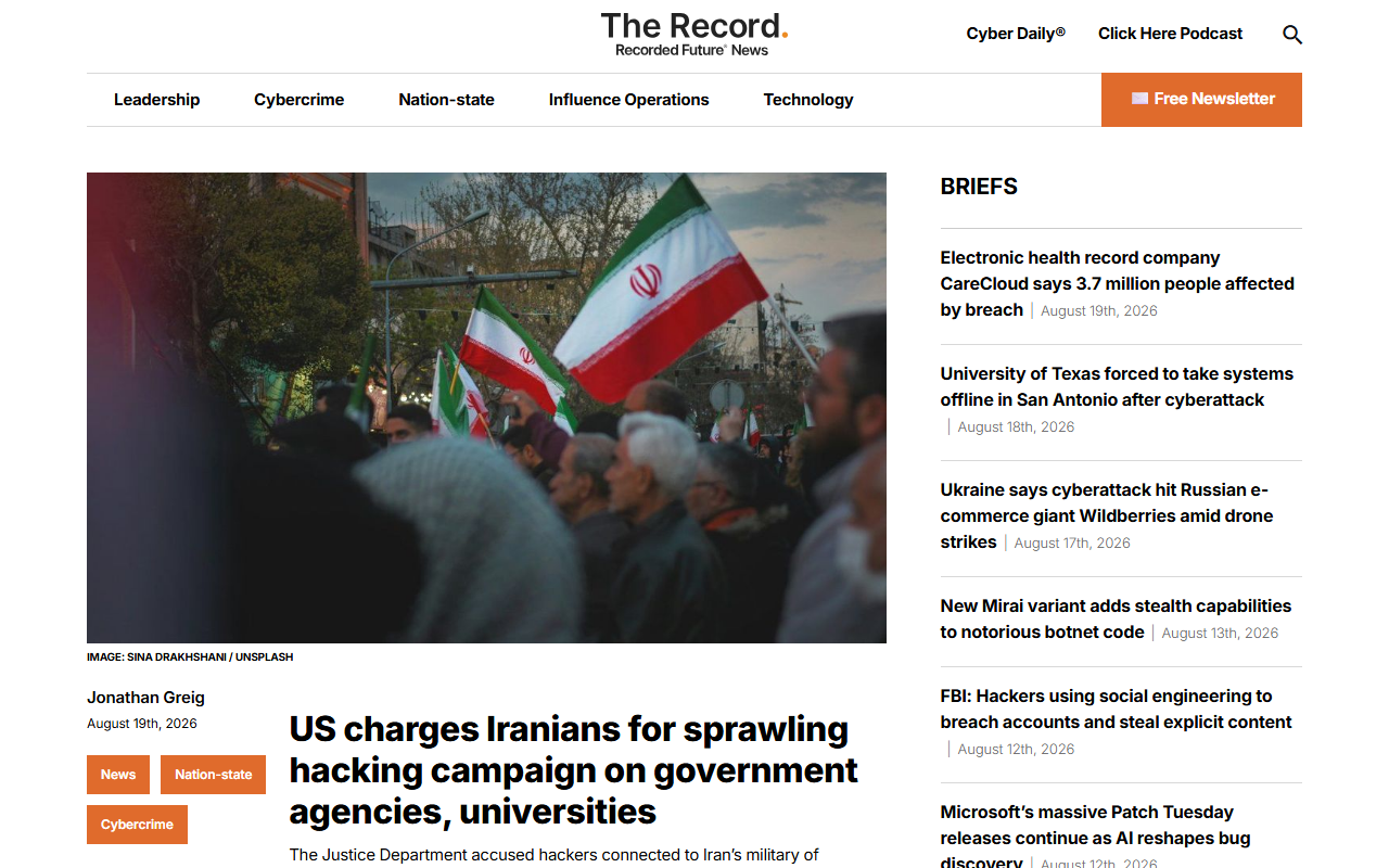 Screenshot of The Record's report on the DOJ charging Iranian nationals over hacking US agencies and universities.